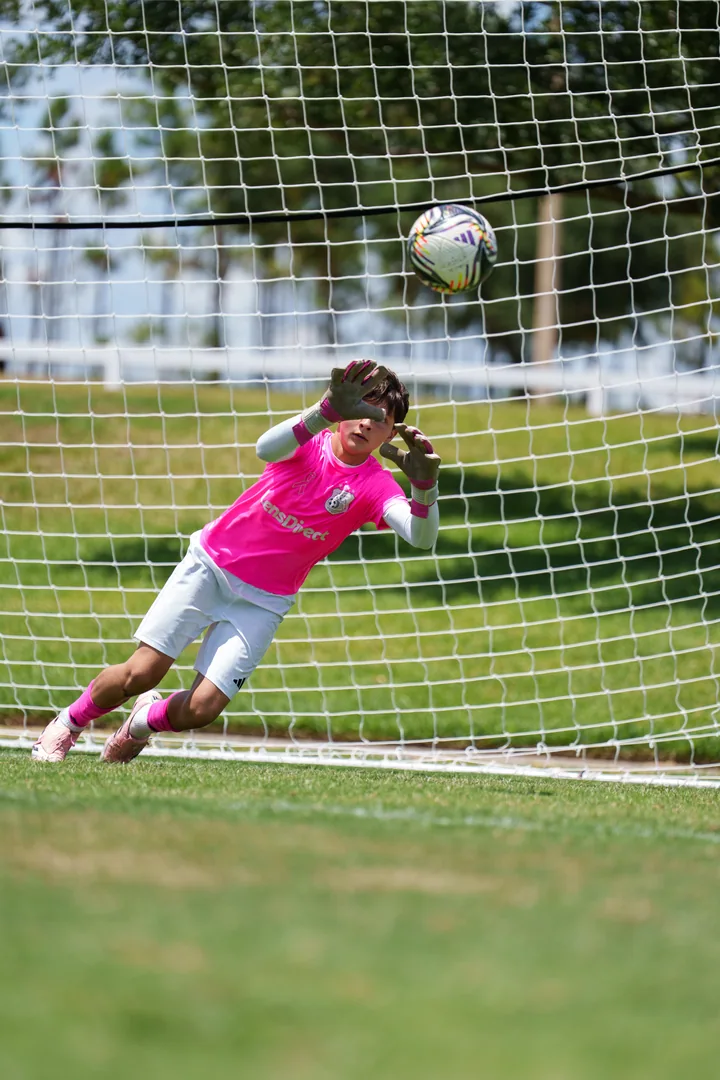 Gavin diving with his eyes on the approaching ball