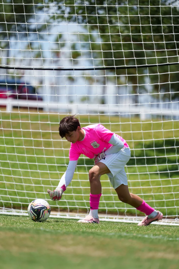 Gavin rolling the ball out from the goal